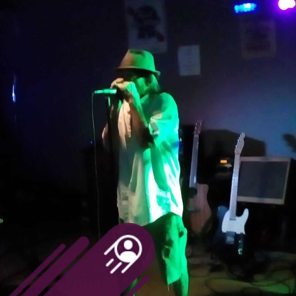 Dennis Bain singing live on stage